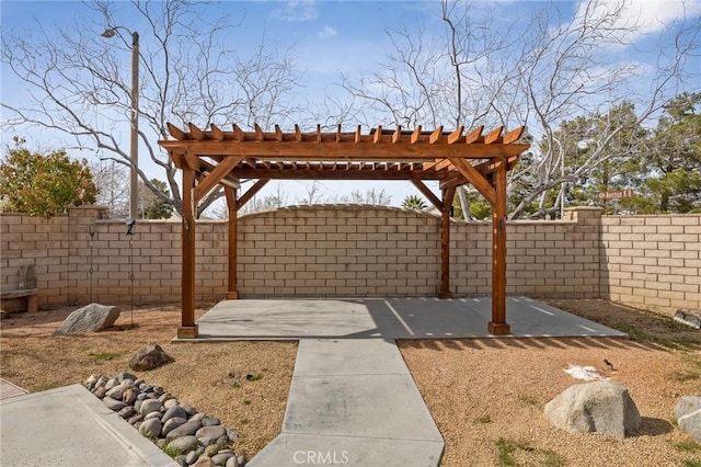 exterior space featuring a fenced backyard and a pergola