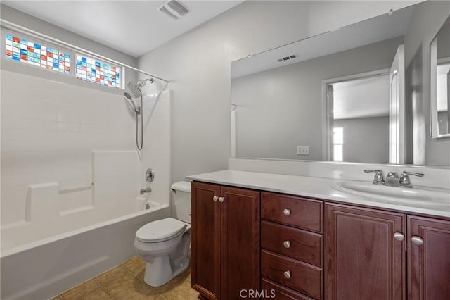 bathroom with tile patterned flooring, visible vents, toilet, and vanity