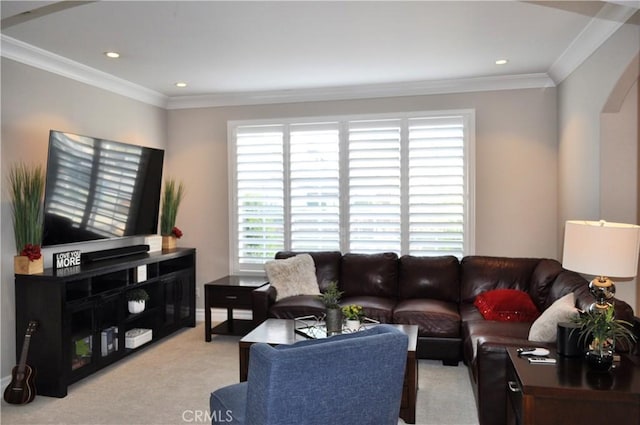 living room with recessed lighting, arched walkways, light colored carpet, and ornamental molding