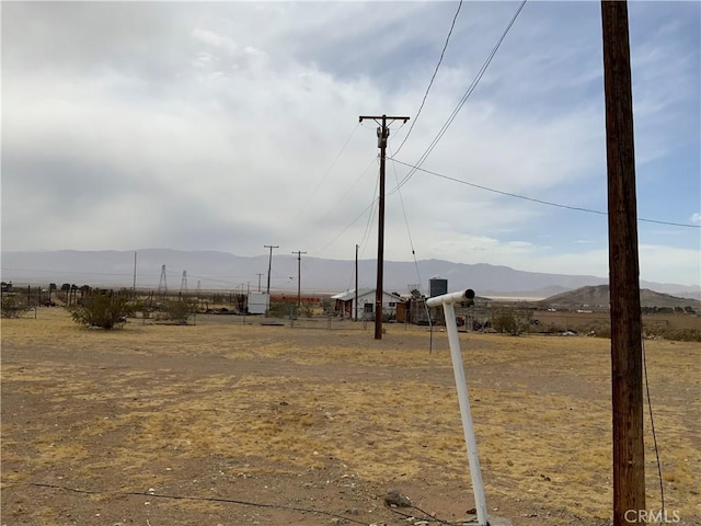 view of yard featuring a mountain view and a rural view