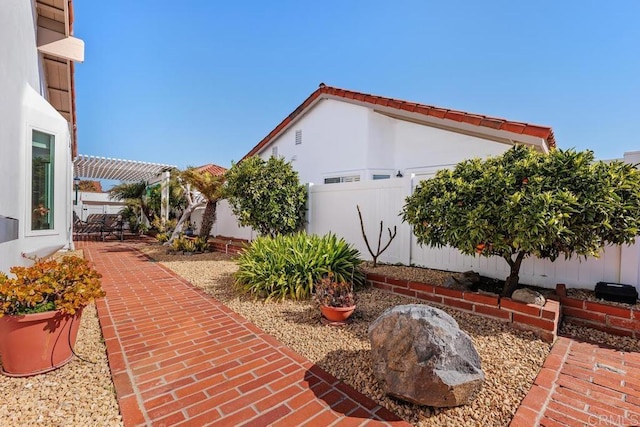 view of property exterior with a patio and a fenced backyard