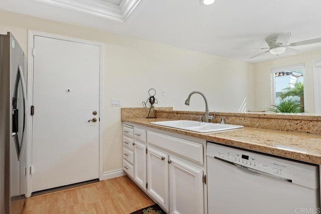 kitchen with dishwasher, light wood-style floors, stainless steel refrigerator with ice dispenser, white cabinetry, and a sink