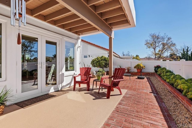 view of patio / terrace featuring french doors and a fenced backyard