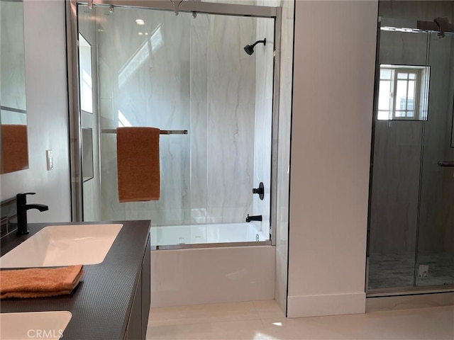 bathroom with combined bath / shower with glass door and vanity