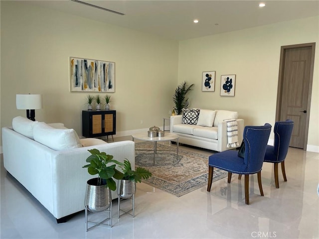 living area with recessed lighting and baseboards