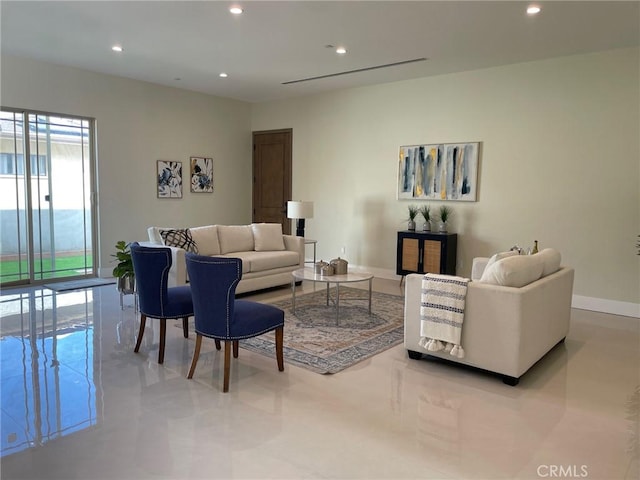 living area with recessed lighting and baseboards