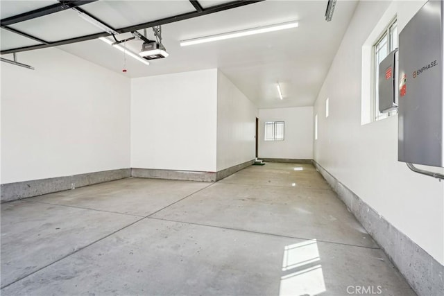 garage featuring a garage door opener and electric panel