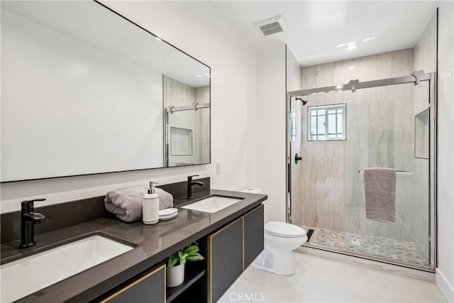 full bathroom featuring toilet, a marble finish shower, a sink, and visible vents