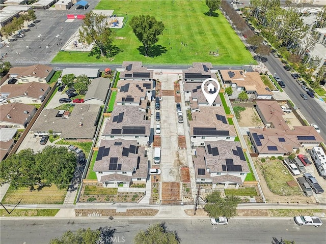 birds eye view of property with a residential view