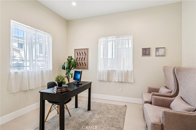 office space with baseboards and recessed lighting