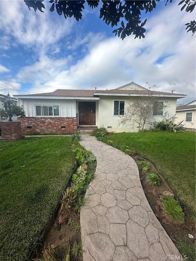 single story home with crawl space and a front yard