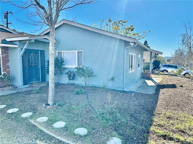 view of property exterior with stucco siding