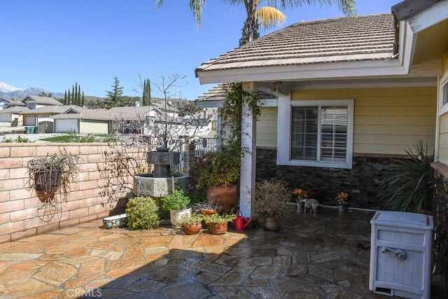 view of patio featuring fence