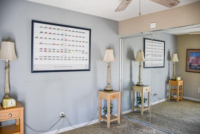 interior space featuring a closet, baseboards, and ceiling fan