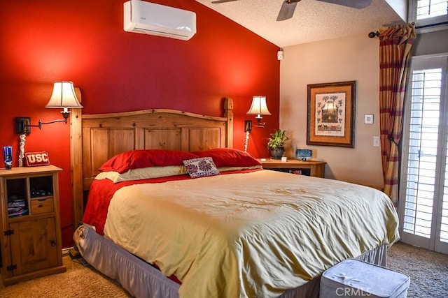 bedroom with ceiling fan, a wall mounted air conditioner, vaulted ceiling, carpet flooring, and a textured ceiling