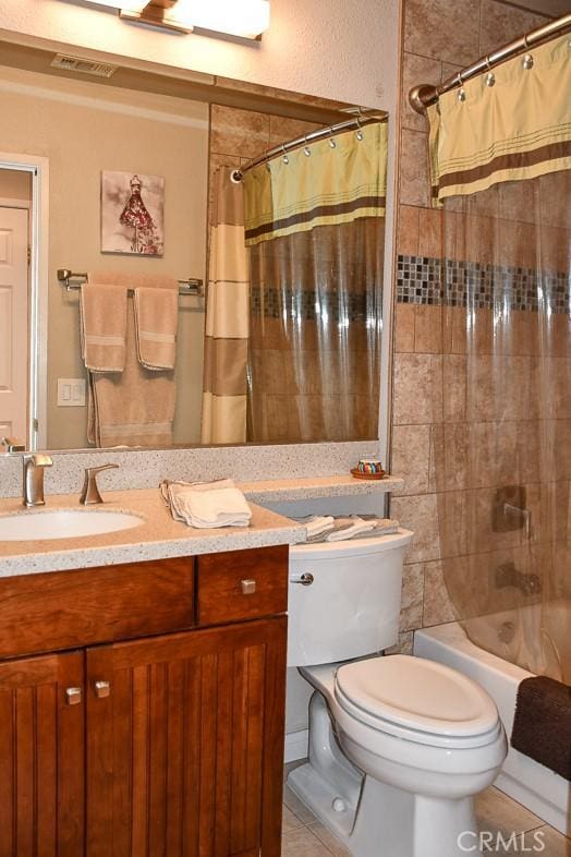 bathroom with tile patterned flooring, visible vents, toilet, shower / tub combo, and vanity