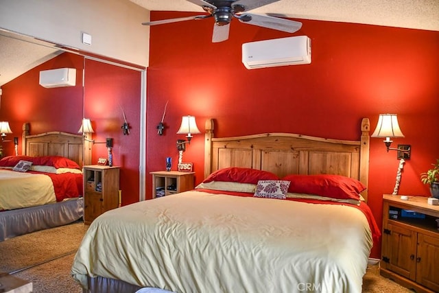 bedroom featuring lofted ceiling, carpet flooring, and a wall mounted air conditioner