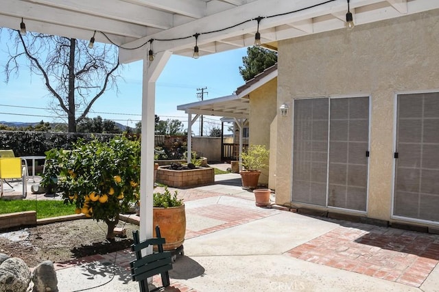 view of patio / terrace featuring fence