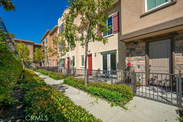 exterior space with fence and a residential view