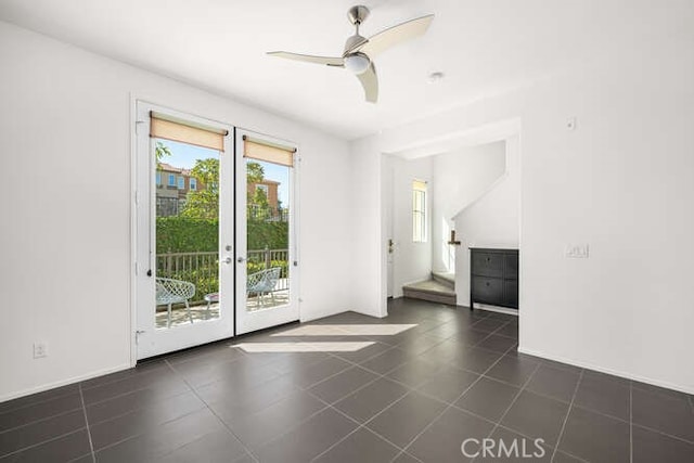 unfurnished room with french doors, a ceiling fan, and tile patterned flooring