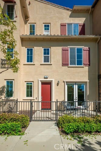 view of building exterior featuring fence