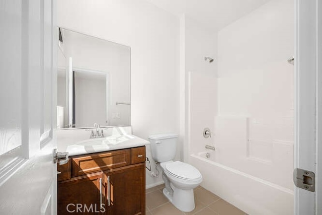 full bath featuring tile patterned floors, toilet, vanity, and shower / bath combination