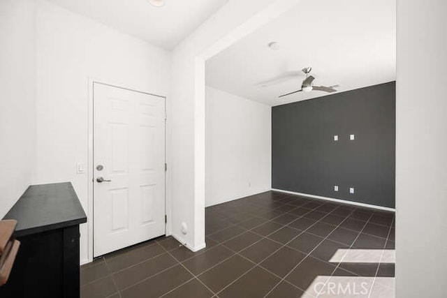 interior space with dark tile patterned flooring