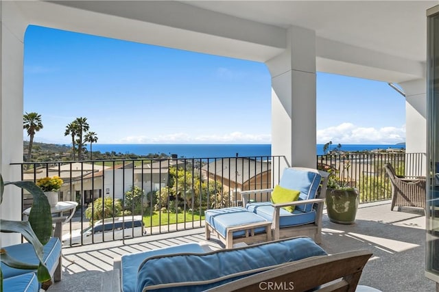 balcony featuring a water view