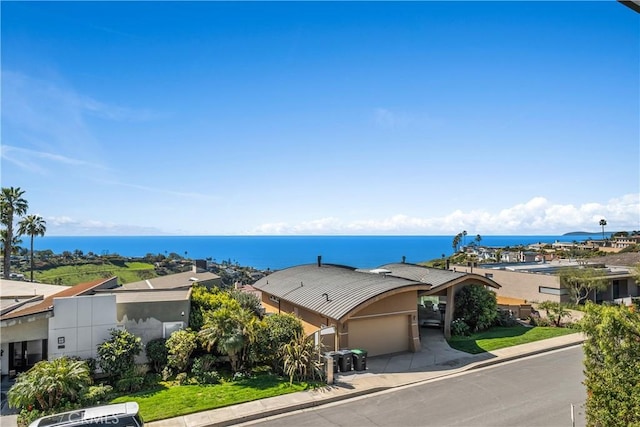 birds eye view of property featuring a water view