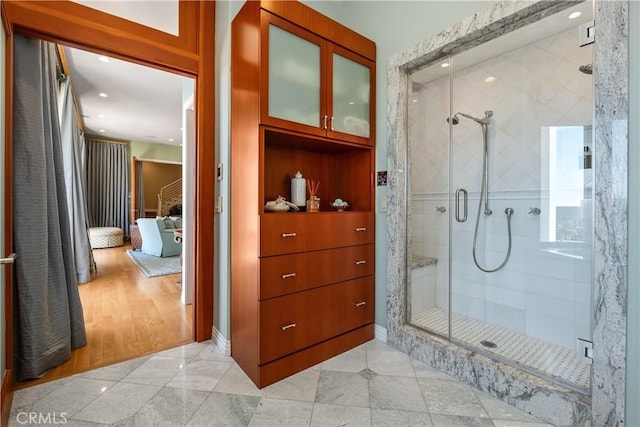 bathroom featuring recessed lighting and a stall shower