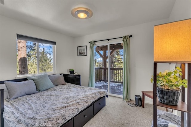 bedroom featuring access to outside and light colored carpet