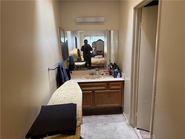 bathroom with vanity and a wall unit AC