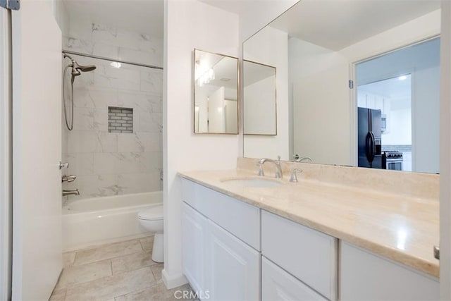 bathroom with vanity, toilet, and washtub / shower combination