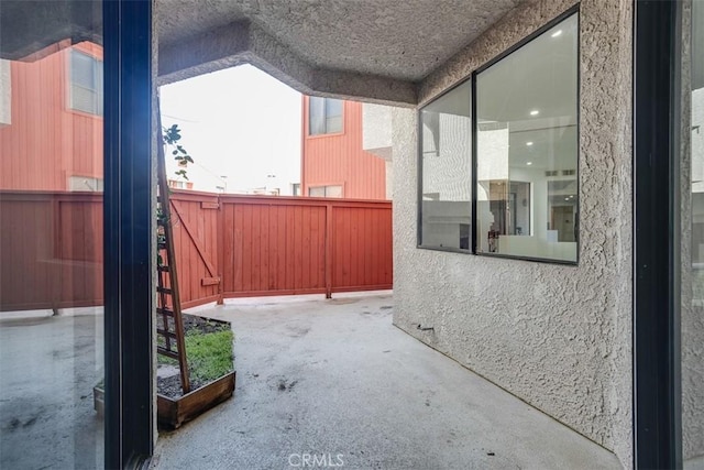 view of patio / terrace featuring fence