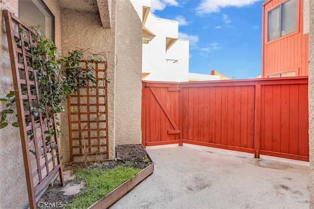 view of gate featuring fence