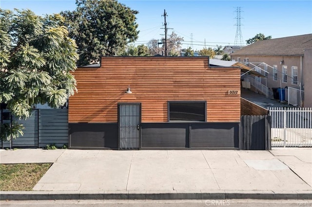 view of property exterior with fence