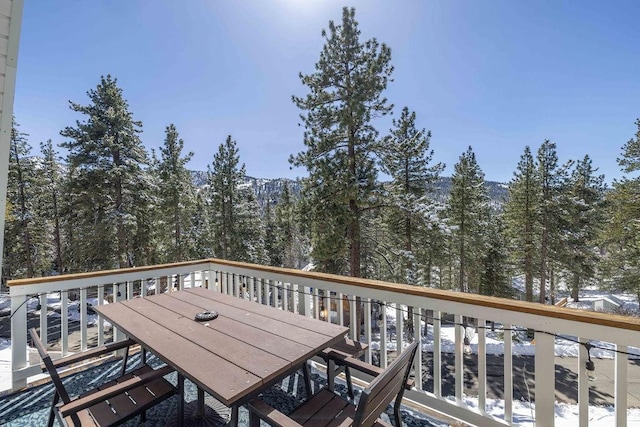 wooden deck with outdoor dining space