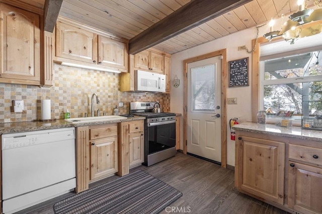 kitchen featuring white appliances, light brown cabinets, a sink, beamed ceiling, and tasteful backsplash