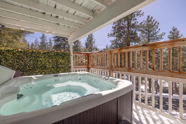 wooden deck featuring a hot tub