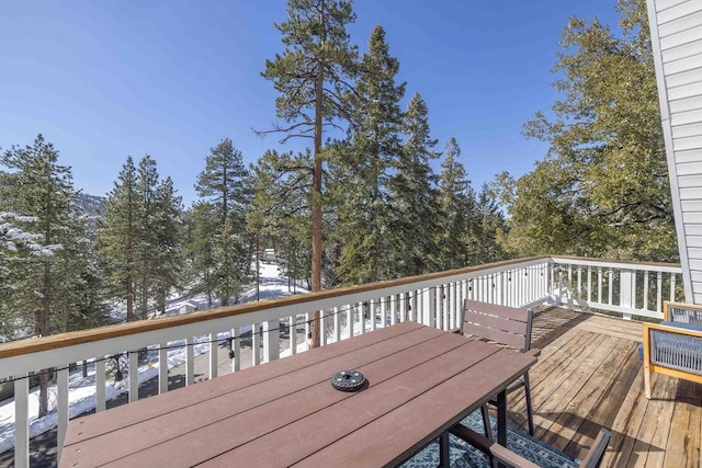 deck featuring outdoor dining area