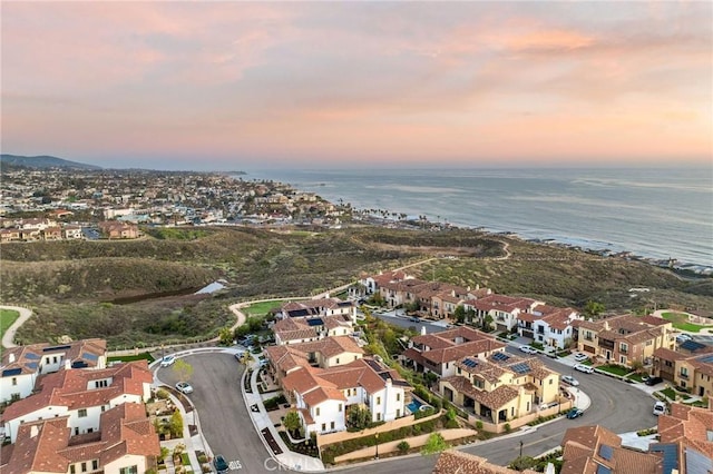 aerial view with a water view and a residential view