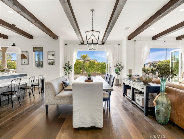 dining area featuring a notable chandelier, dark wood-type flooring, and visible vents