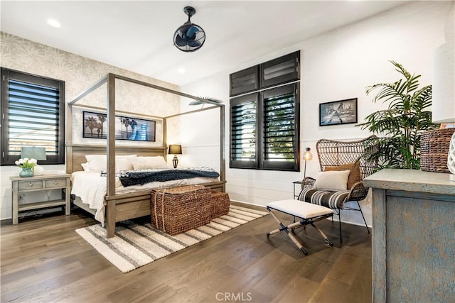 bedroom with recessed lighting and wood finished floors