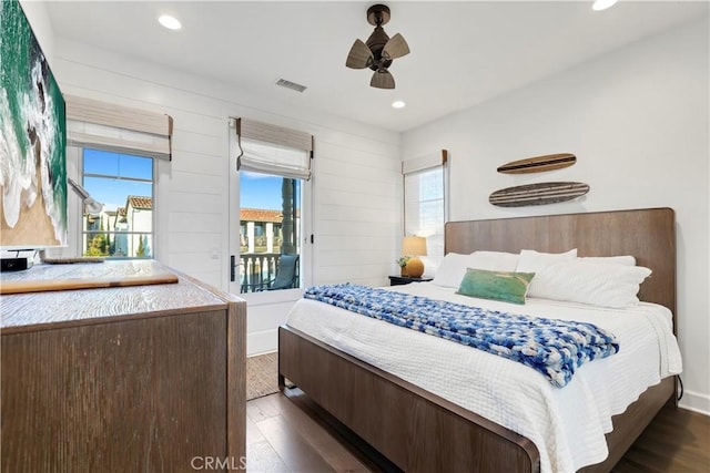 bedroom featuring recessed lighting, visible vents, dark wood finished floors, and access to outside