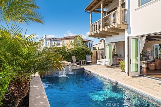 view of swimming pool featuring a fenced in pool and a patio