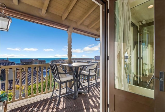 balcony featuring a water view