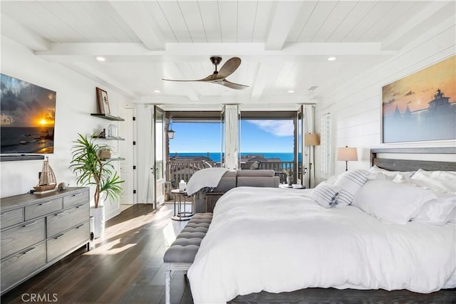 bedroom featuring wood finished floors, beam ceiling, access to exterior, and a ceiling fan