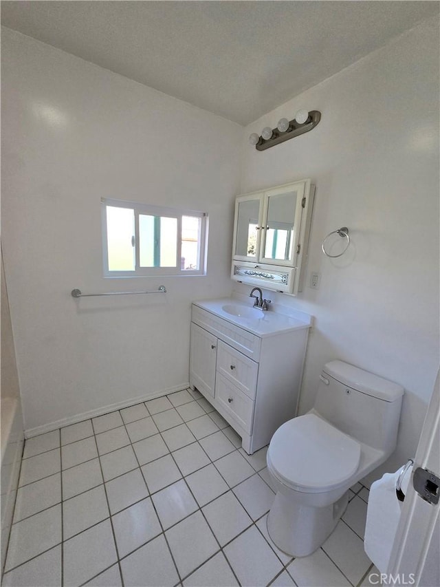 full bathroom with tile patterned floors, toilet, and vanity