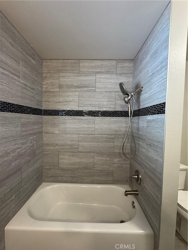 full bathroom featuring shower / bath combination and toilet