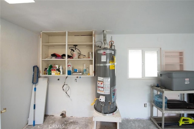 utility room featuring strapped water heater